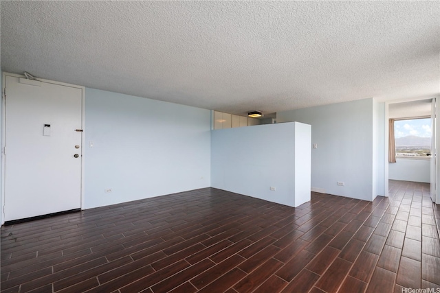 98-288 Kaonohi St Unit 1107, Aiea, HI 96701 - spare room with dark wood finished floors and a textured ceiling