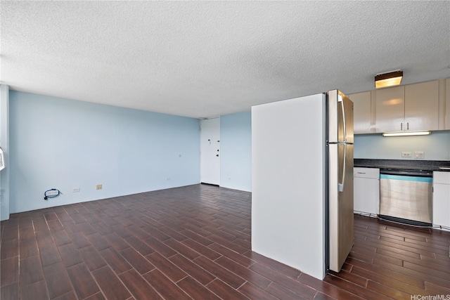 98-288 Kaonohi St Unit 1107, Aiea, HI 96701 - kitchen with dishwasher, freestanding refrigerator, dark wood-type flooring, dark countertops, and a textured ceiling