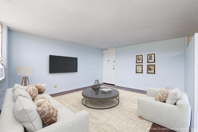 98-288 Kaonohi St Unit 1107, Aiea, HI 96701 - living area with a textured ceiling and wood finished floors