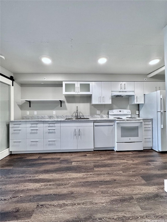 803 Waimanu St Unit 204, Honolulu, HI 96813 - kitchen featuring white appliances, a sink, white cabinets, dark wood-style floors, and recessed lighting