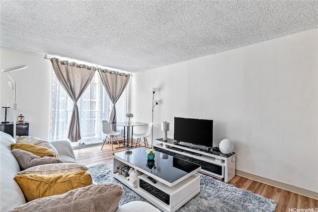 2452 Tusitala St Unit 705, Honolulu, HI 96815 - living room featuring wood finished floors and a textured ceiling