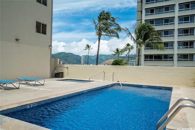 2452 Tusitala St Unit 705, Honolulu, HI 96815 - community pool featuring a mountain view and a patio