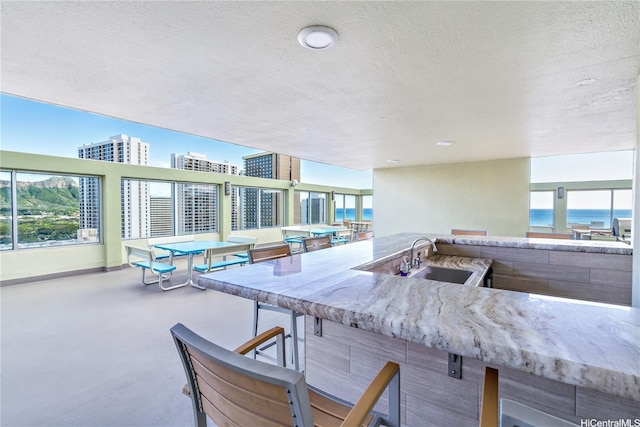 2452 Tusitala St Unit 705, Honolulu, HI 96815 - view of patio / terrace with an outdoor bar