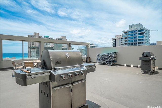 2452 Tusitala St Unit 705, Honolulu, HI 96815 - view of patio / terrace featuring area for grilling and a water view