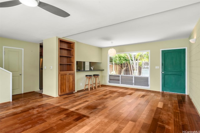 609 Koko Isle Cir Unit 1205, Honolulu, HI 96825 - unfurnished living room with hardwood / wood-style floors and ceiling fan