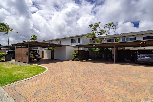 609 Koko Isle Cir Unit 1205, Honolulu, HI 96825 - view of front of home featuring covered parking and stucco siding