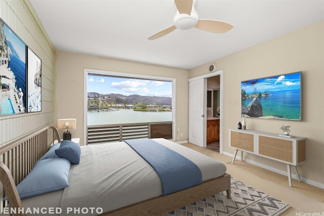 609 Koko Isle Cir Unit 1205, Honolulu, HI 96825 - carpeted bedroom with baseboards and ceiling fan