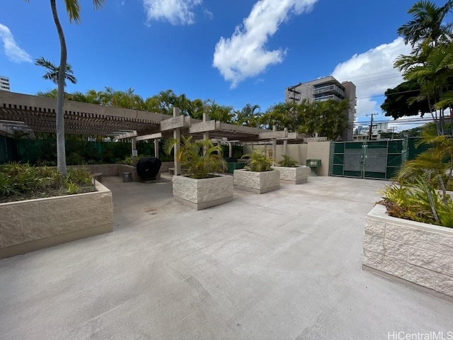 1441 Piikoi St Unit 402, Honolulu, HI 96822 - view of patio with a gate, a pergola, and fence