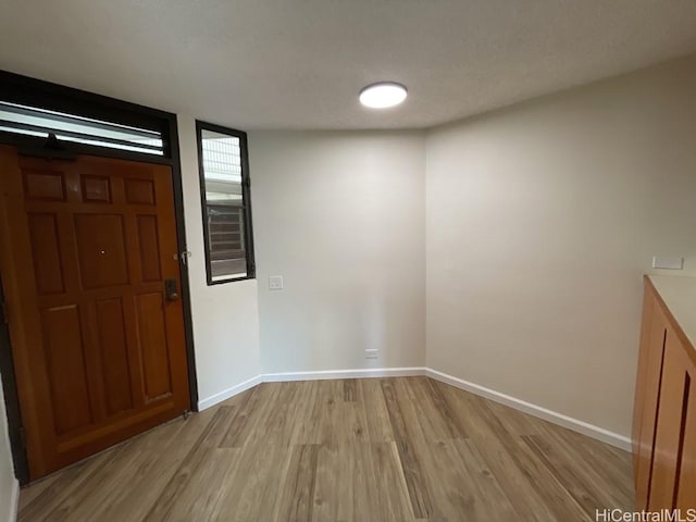 1441 Piikoi St Unit 402, Honolulu, HI 96822 - foyer entrance featuring light wood-type flooring and baseboards