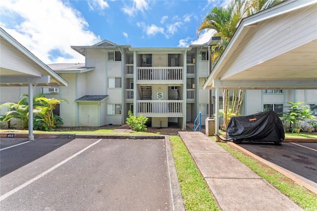 95-798 Wikao St Unit S104, Mililani, HI 96789 - view of building exterior featuring uncovered parking