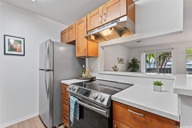 95-798 Wikao St Unit S104, Mililani, HI 96789 - kitchen with stainless steel appliances, light countertops, and light wood-type flooring