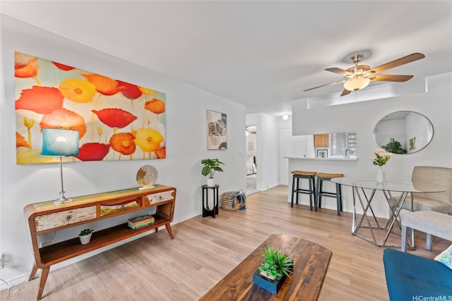 95-798 Wikao St Unit S104, Mililani, HI 96789 - living room with a ceiling fan, baseboards, and wood finished floors