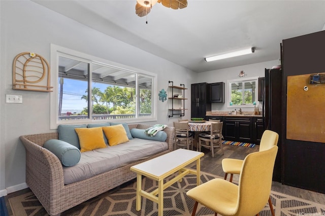 53-440 Kamehameha Hwy Unit 8, Hauula, HI 96717 - living area with plenty of natural light, dark wood-style floors, and baseboards