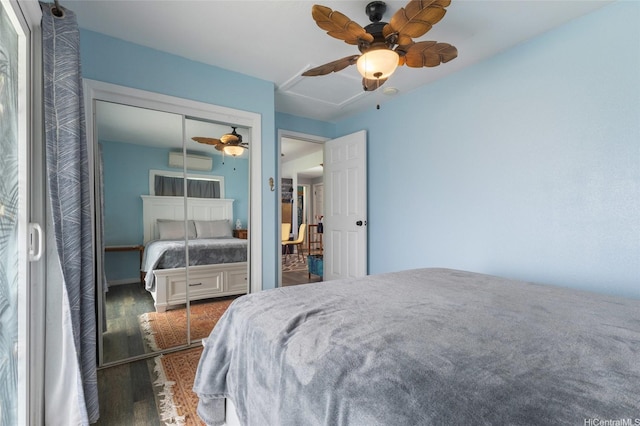 53-440 Kamehameha Hwy Unit 8, Hauula, HI 96717 - bedroom with a wall mounted air conditioner, wood finished floors, attic access, a closet, and ceiling fan