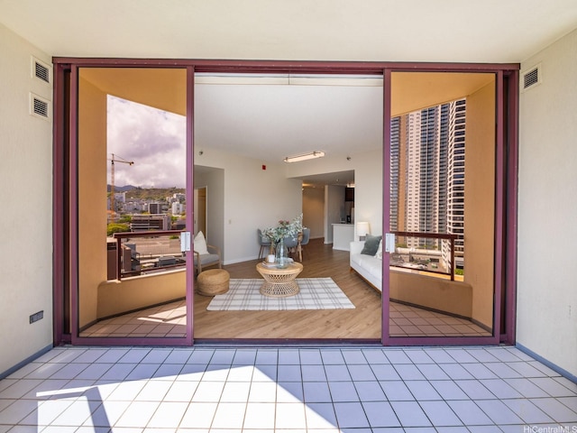 725 Kapiolani Blvd Unit 1105, Honolulu, HI 96813 - doorway to outside featuring tile patterned floors and baseboards