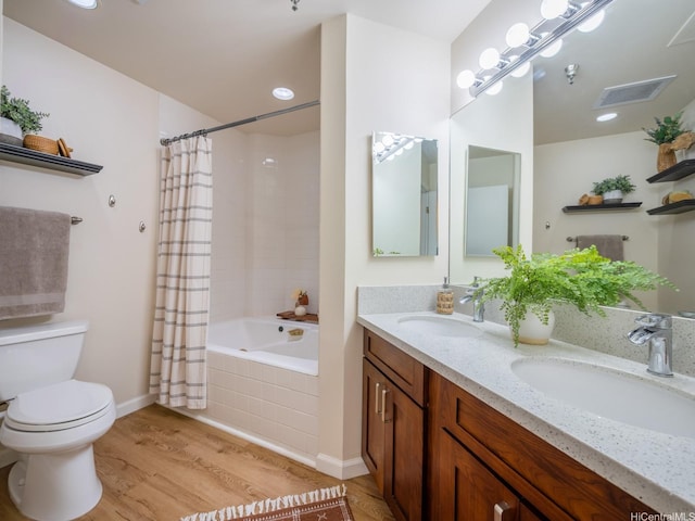 725 Kapiolani Blvd Unit 1105, Honolulu, HI 96813 - full bath with toilet, wood finished floors, shower / bath combination with curtain, and double vanity