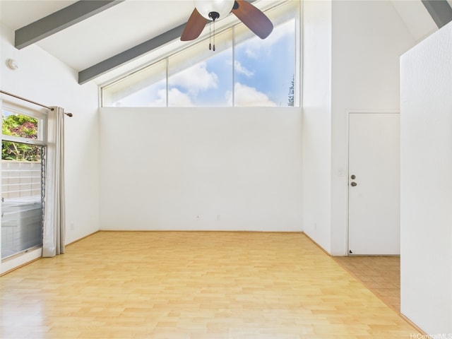 94-425 Lanikuhana Pl Unit 1100, Mililani, HI 96789 - unfurnished room featuring wood finished floors, beam ceiling, a ceiling fan, and high vaulted ceiling