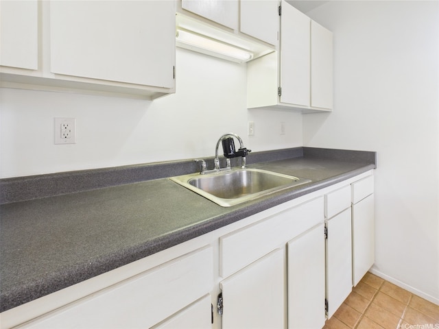 94-425 Lanikuhana Pl Unit 1100, Mililani, HI 96789 - kitchen featuring a sink, dark countertops, white cabinetry, and light tile patterned floors