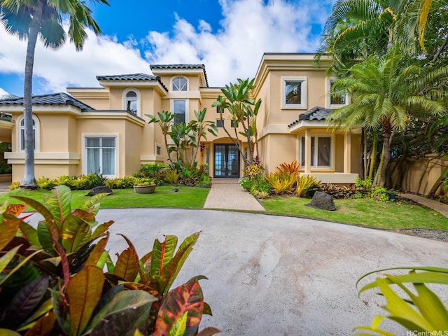 756 Mokulua Dr, Kailua, HI 96734 - mediterranean / spanish-style home featuring french doors, stucco siding, and a tiled roof