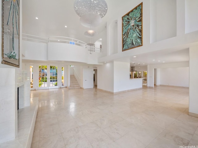 756 Mokulua Dr, Kailua, HI 96734 - unfurnished living room featuring a high ceiling, a premium fireplace, and recessed lighting