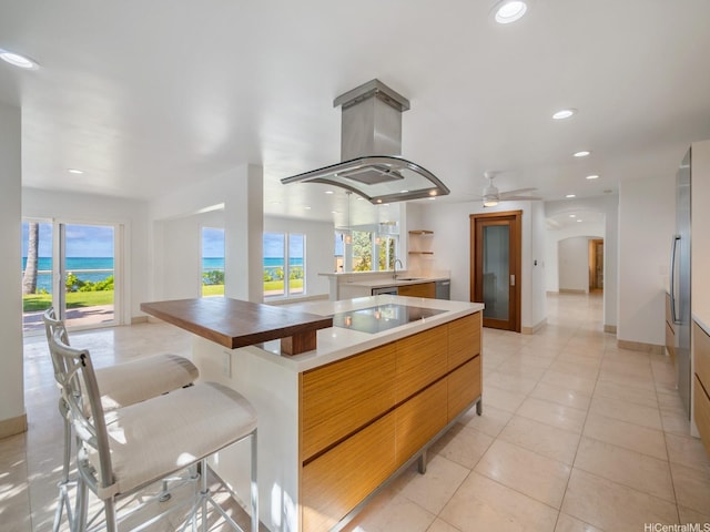 756 Mokulua Dr, Kailua, HI 96734 - kitchen featuring modern cabinets, island range hood, black electric cooktop, recessed lighting, and a ceiling fan