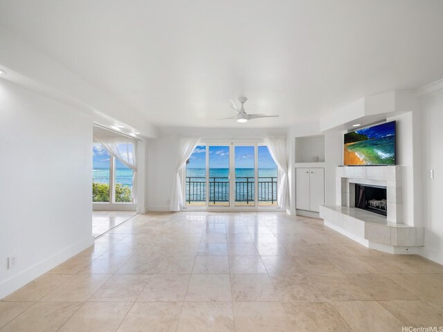 756 Mokulua Dr, Kailua, HI 96734 - unfurnished living room featuring a ceiling fan and a tiled fireplace