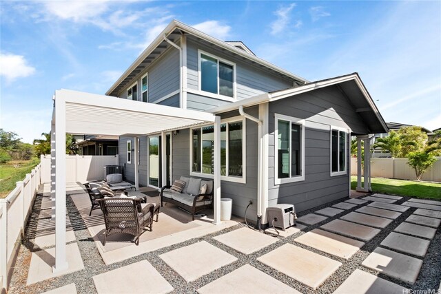 91-1123 Hokua St, Ewa Beach, HI 96706 - rear view of house featuring a patio, an outdoor hangout area, and a fenced backyard