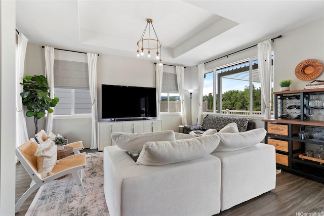 91-1123 Hokua St, Ewa Beach, HI 96706 - living area with wood finished floors, a tray ceiling, and a chandelier
