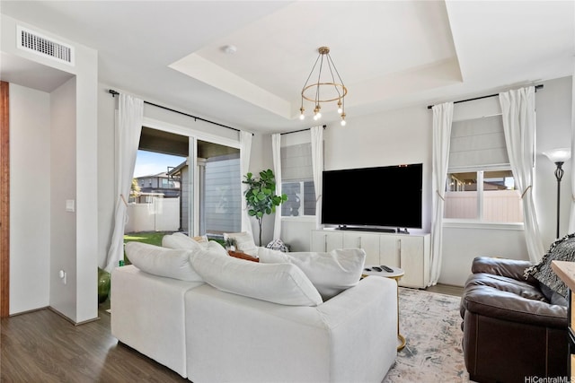 91-1123 Hokua St, Ewa Beach, HI 96706 - living room with wood finished floors, a raised ceiling, and a chandelier