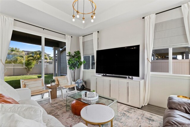 91-1123 Hokua St, Ewa Beach, HI 96706 - living area with wood finished floors and a chandelier