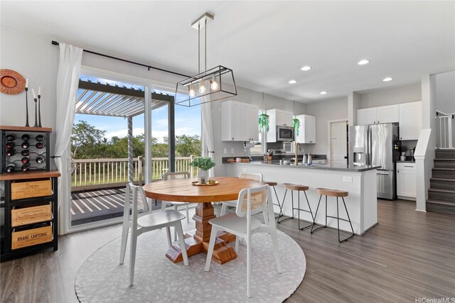 91-1123 Hokua St, Ewa Beach, HI 96706 - dining room with stairway, recessed lighting, and wood finished floors