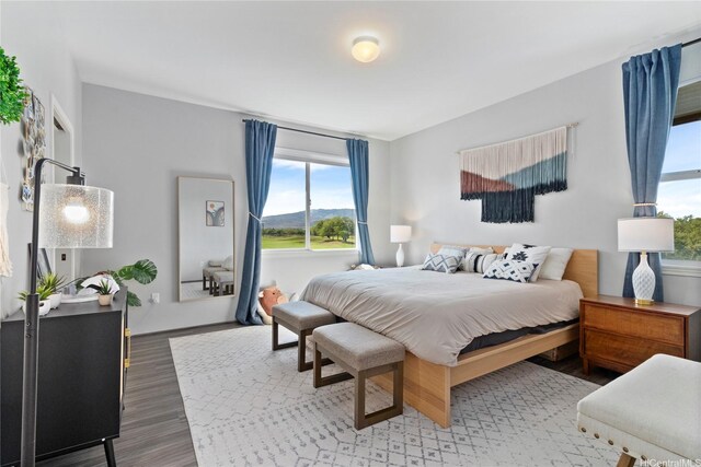 91-1123 Hokua St, Ewa Beach, HI 96706 - bedroom featuring multiple windows and wood finished floors
