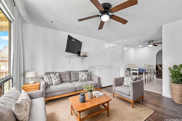 94-328 Hakamoa St, Mililani, HI 96789 - living area with ceiling fan, a textured ceiling, and wood finished floors
