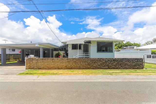 725 Kalolina Pl, Kailua, HI 96734 - view of front facade with a fenced front yard, concrete driveway, and a carport