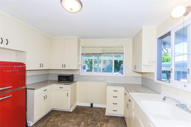 725 Kalolina Pl, Kailua, HI 96734 - kitchen with a sink, light countertops, stainless steel microwave, and white cabinetry