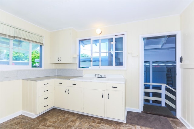 725 Kalolina Pl, Kailua, HI 96734 - kitchen featuring light countertops, white cabinets, and a sink