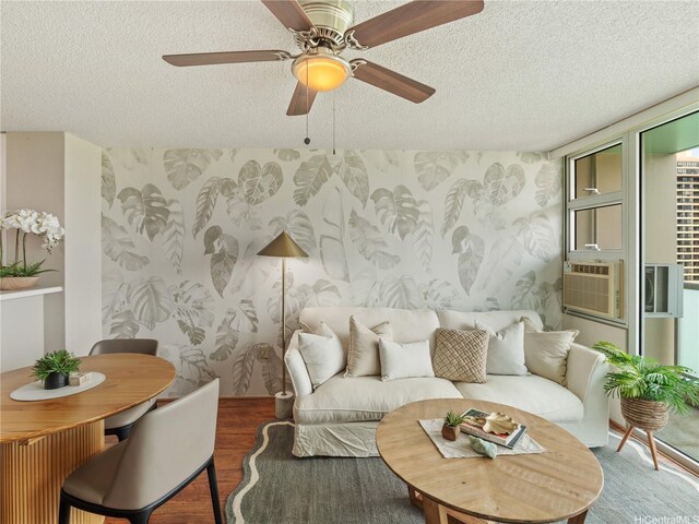 3009 Ala Makahala Pl Unit 1507, Honolulu, HI 96818 - living area featuring wood finished floors, a textured ceiling, ceiling fan, and cooling unit
