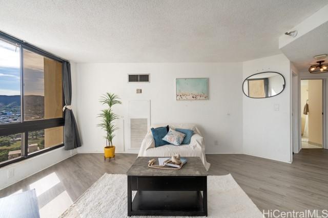 300 Wai Nani Way Unit 1815, Honolulu, HI 96815 - living room featuring a textured ceiling and wood finished floors