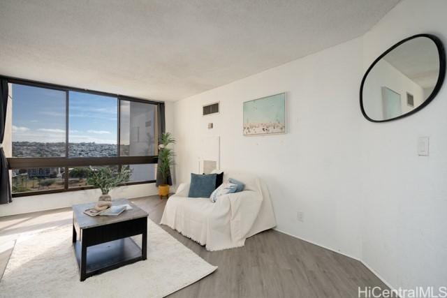 300 Wai Nani Way Unit 1815, Honolulu, HI 96815 - living area with wood finished floors and baseboards