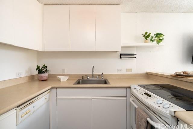 300 Wai Nani Way Unit 1815, Honolulu, HI 96815 - kitchen with white appliances, a sink, white cabinets, and light countertops