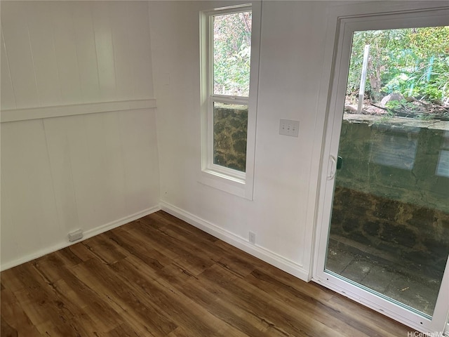 252 Moomuku Pl Unit 4, Honolulu, HI 96821 - empty room with dark wood finished floors, baseboards, and healthy amount of natural light