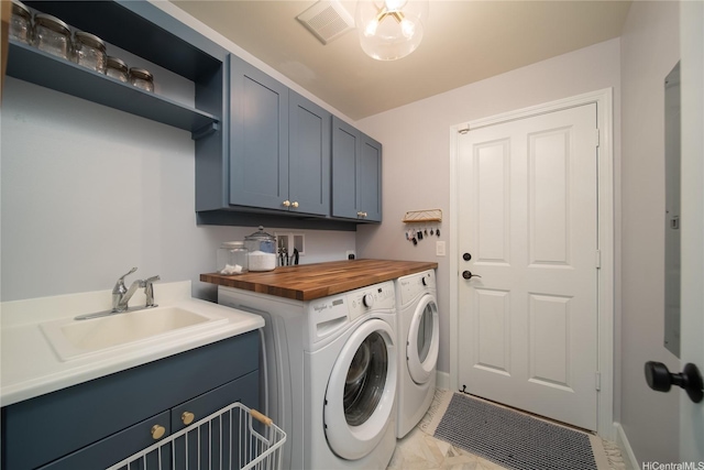 91-1124 Kai Oio St, Ewa Beach, HI 96706 - laundry room featuring cabinet space, independent washer and dryer, and light marble finish flooring