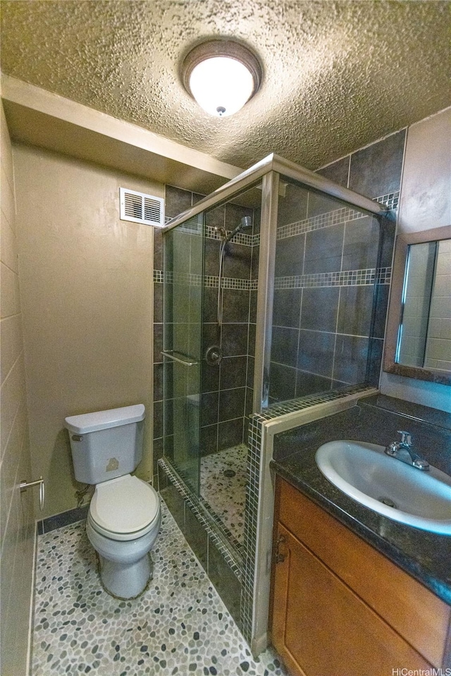 84-965 Farrington Hwy Unit B216, Waianae, HI 96792 - full bathroom with toilet, a shower stall, vanity, and a textured ceiling