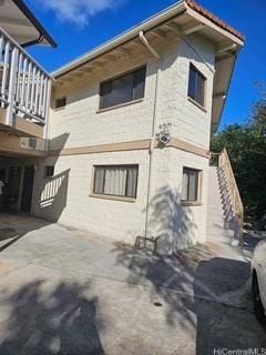 2123 Wilson St, Honolulu, HI 96819 - view of home's exterior with stairs and a balcony