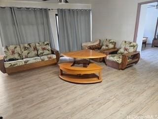 2123 Wilson St, Honolulu, HI 96819 - sitting room with a ceiling fan and wood finished floors