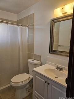 2123 Wilson St, Honolulu, HI 96819 - full bath featuring vanity, toilet, a shower with curtain, and tile patterned floors