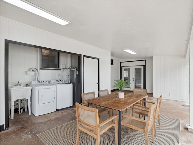 87-153 Kimo St, Waianae, HI 96792 - dining space featuring french doors, concrete floors, water heater, washing machine and clothes dryer, and a decorative wall