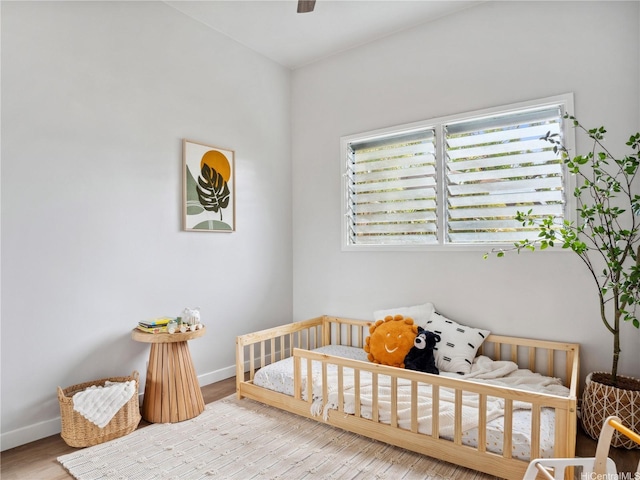 87-153 Kimo St, Waianae, HI 96792 - bedroom with a nursery area, baseboards, and wood finished floors