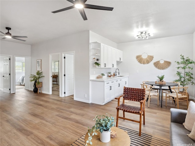 87-153 Kimo St, Waianae, HI 96792 - living room with ceiling fan, light wood finished floors, and baseboards