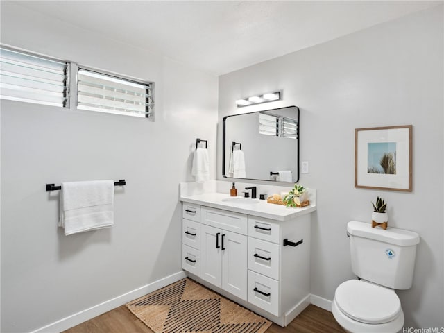 87-153 Kimo St, Waianae, HI 96792 - half bath with plenty of natural light, baseboards, wood finished floors, and toilet